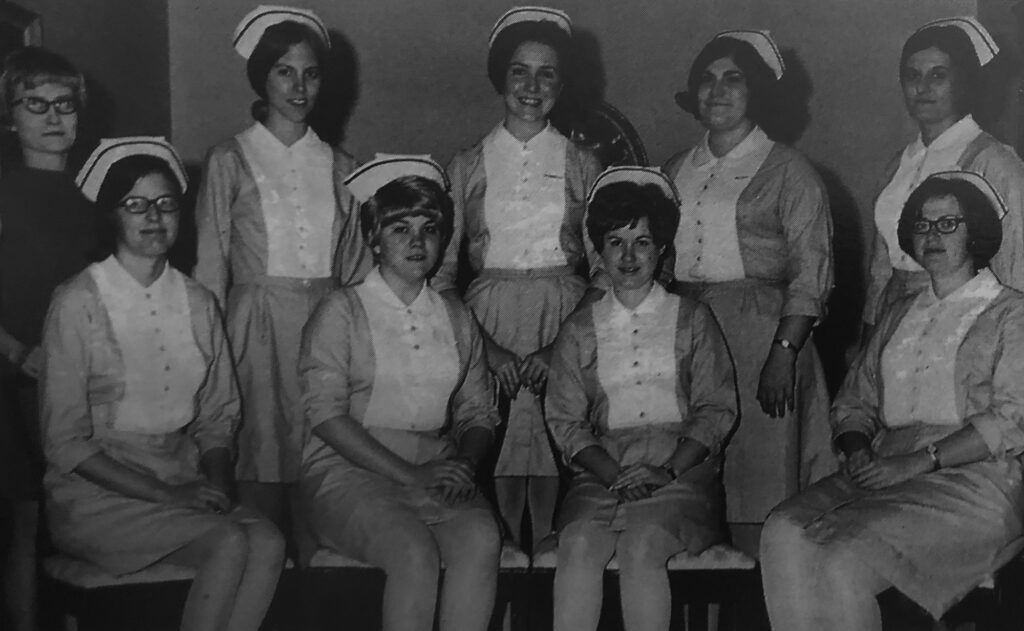 Early nursing graduates pose for a photo