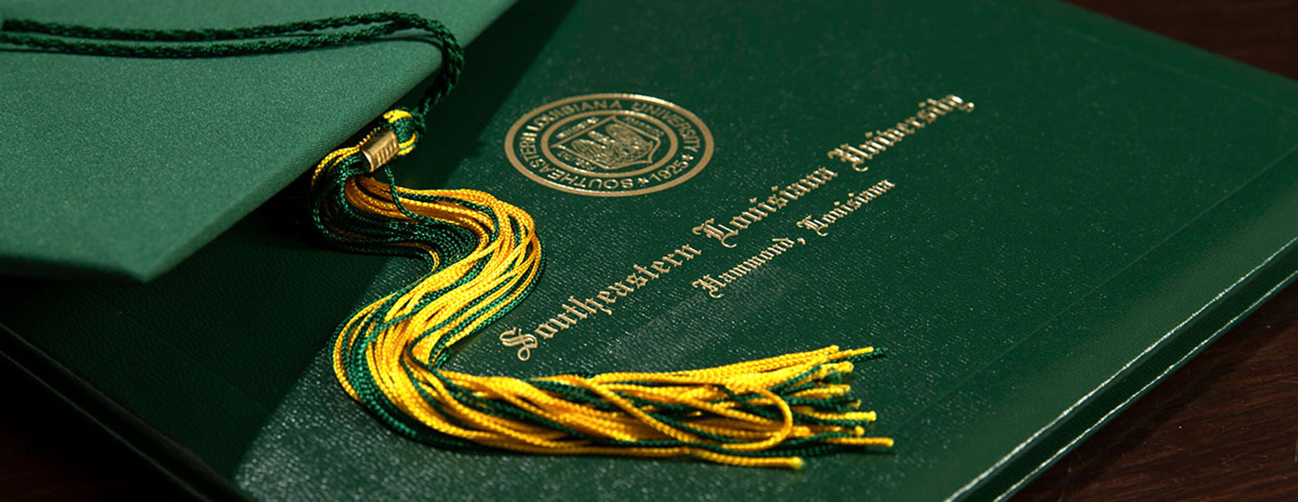 grad hat with diploma cover