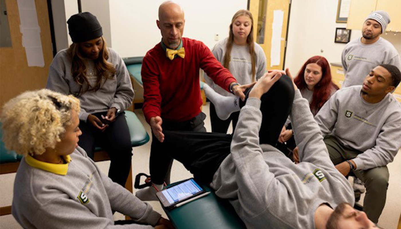 Southeastern Louisiana University Master of Science in Athletic Training students watch hip evaluation demonstrations performed by program director Ryan Green, LAT, ATC, in lower body assessment class.