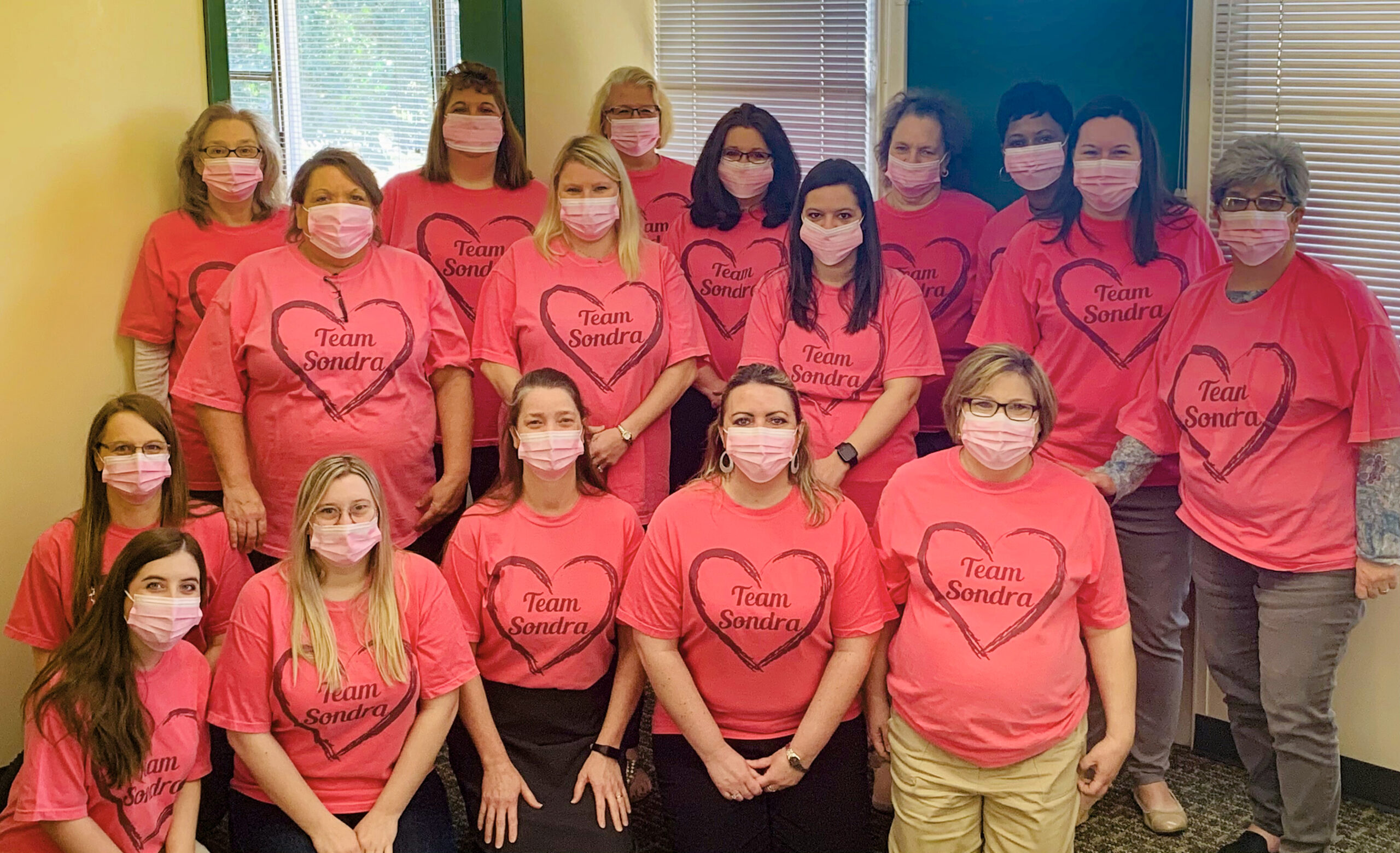 group of women wearing team sondra shirt